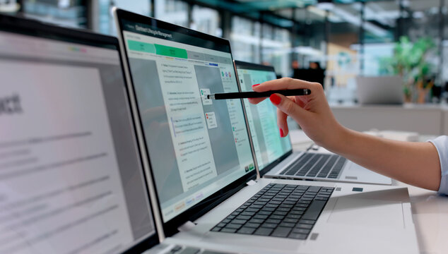 Woman Reviews Multiple Digital Contracts On Laptop