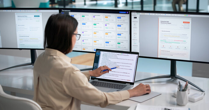 Woman Reads And Edits Text Documents On Laptop