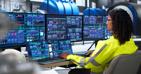 Woman Engineer Checks Turbine Control System Using Laptop