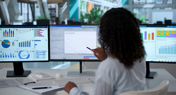 Young Woman Analyzing Financial Dashboard Data