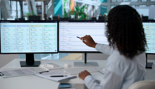 Young Sales Manager Analyzes Pipeline Data On Computer
