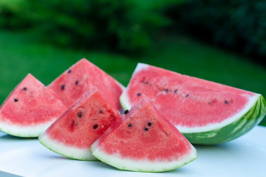 Juicy Watermelon Slices on White Table Viewed from Above