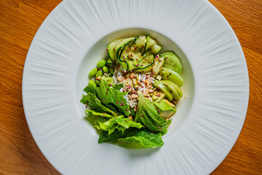 Fresh and vibrant salad brimming with greens, nuts, and colorful toppings