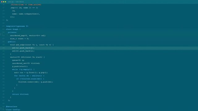 Close up of computer screen showing scrolling lines of software code in a dark mode editor