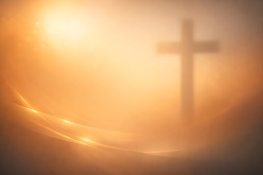 christian cross silhouette at sunrise with warm golden light
