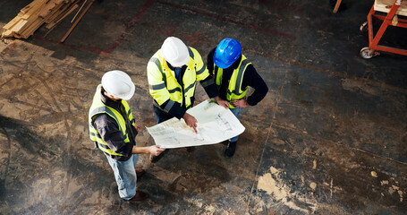 Naklejka premium Top view, architect and planning with blueprint at construction site, building development or layout. Engineer team, people and discussion with document for infrastructure design, review and above