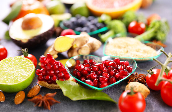 Healthy superfood selection with pomegranate seeds and fresh ingredients
