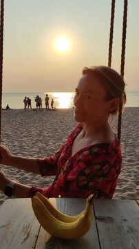 BERDSK, NOVOSIBIRSK, SIBERIA - 12 JULY 2026: The beach in Old Berdsk Park in the summer during sunset. People are relaxing in the water and on the sand.