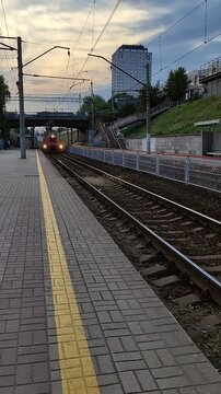 NOVOSIBIRSK, SIBERIA - 16 JULY 2026: The train arriving at the platform with waiting passengers. Editorial.