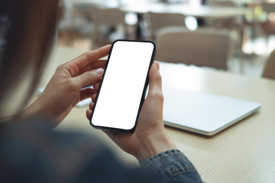 Close up, smart blank screen mockup. Woman using smartphone with blank white screen for social media marketing or mobile app design