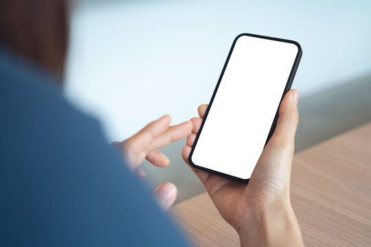 Close up, smartphone blank screen mockup. Woman using smartphone with blank white screen for social media marketing or web template design