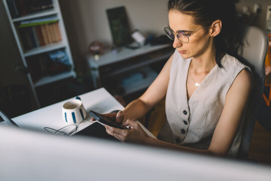 Woman checking messages on smartphone