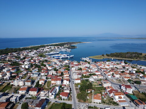Aerial View of a Coastal Town and Harbor with Ferries