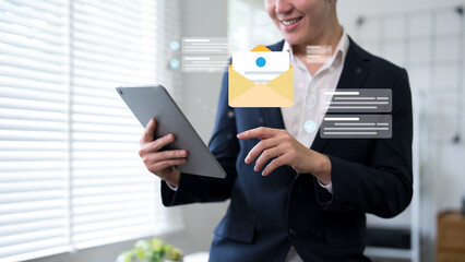 Email communication and digital messaging technology concept with businesswoman using tablet and notification interface © STBSTD
