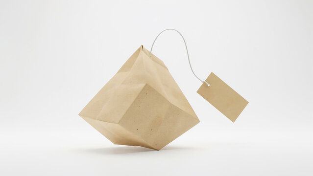 Floating pyramid tea bag with string and tag against a bright white backdrop geometric