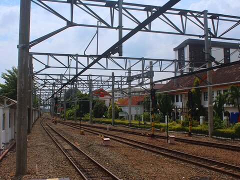 Railway track switch near train station outdoor environment showing cross track direction for transportation network, homecoming trip, and journey connectivity concept.