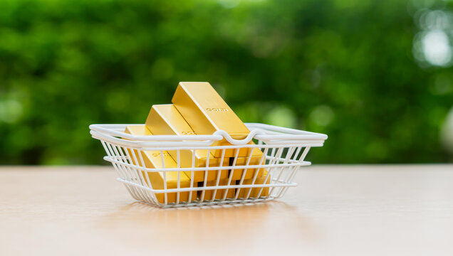 Gold bars placed in a shopping basket, concept investment, wealth preservation, and precious metal purchasing.