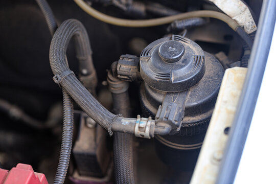 Closeup shot of a car oil filter pot, showcasing its construction and role in maintaining engine performance and lubrication efficiency