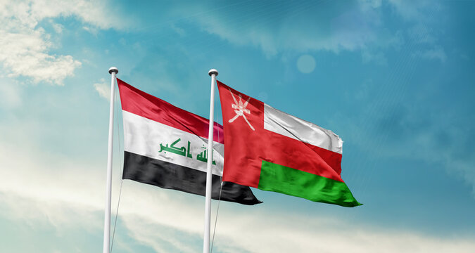 Iraq Oman friendship flags are waving in the sky. Two country flag for agreement or deal. Iraq Oman national flag for commitment.