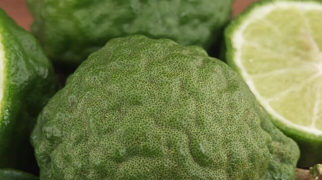Sliced kaffir lime on wooden board.