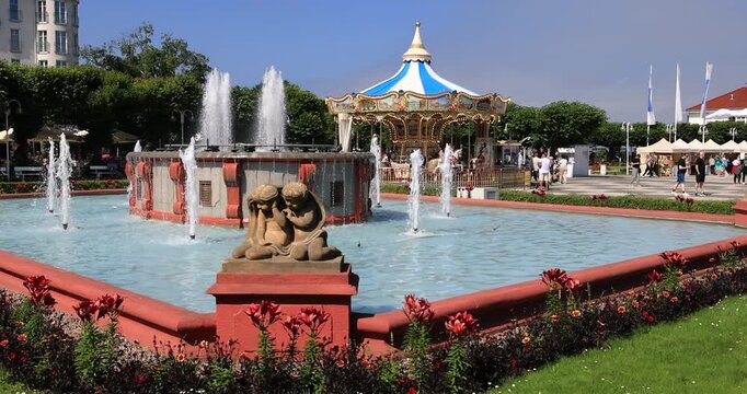 Sopot Poland historic fountain merry go round. Coast northern Poland. World War II started with German invasion. Summer vacation resort destination. Sea beach and longest wooden pier in Euro