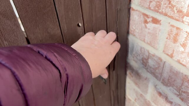 Close-Up of Gate Lock on Wooden Fence