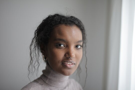 Portrait of a young Black woman looking at camera