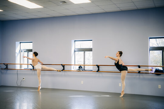 Ballerinas training at dance studio barre