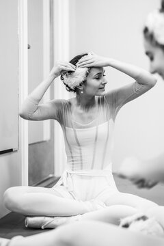 Ballerina preparing costume backstage in dressing room
