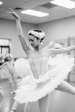 Ballerina performing graceful ballet dance in studio