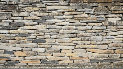 Obraz premium Close Up View of Weathered Natural Dry Stone Wall Texture
