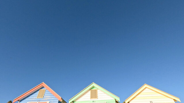 Colorful Brighton Beach Bathing Box Roofs Under Clear Blue Sky