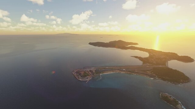 Side aerial drone view at sunset of St George's in Caribbean. Grenada