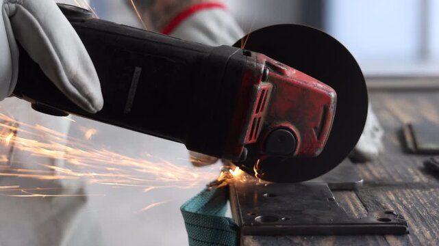 Dynamic golden sparks flying against dark background in industrial metalworking