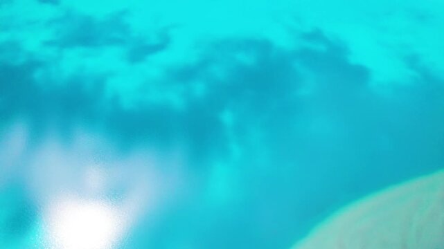 Drone view of Pegu Tso lake or Peikucuo in sunny day in Shigatse, Tibet, China, beautiful peaceful turquoise sea with mountains reflections in Xizang, 4k real time footage travel concept