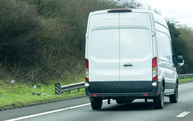White Delivery Van Driving On Highway Road © ANDREW NORRIS