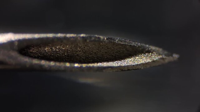 Microscope detail of a medical needle tip, healthcare concept