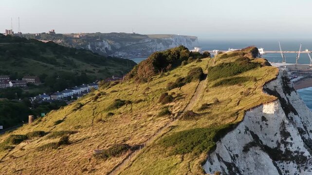 White chalk cliffs of Dover rising above the English Channel during sunny morning