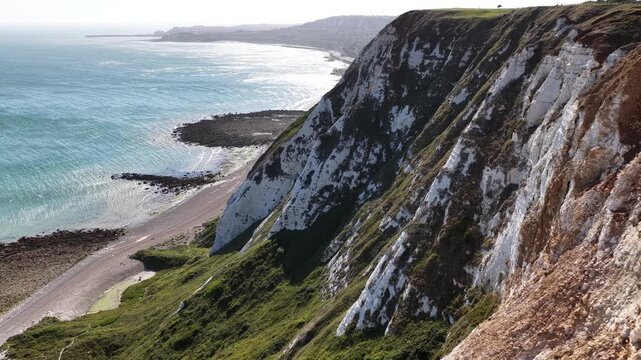 White cliffs of Dover overlooking the blue sea during a sunny afternoon
