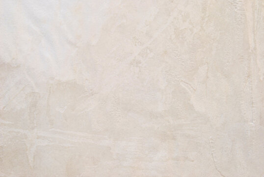 Old beige distressed paper texture with aged stained surface background