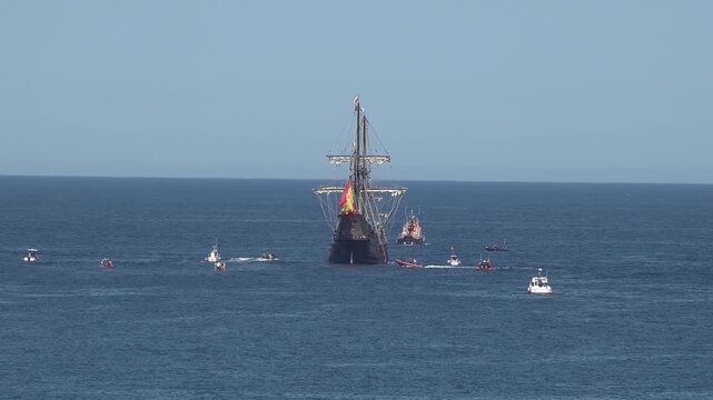 Historic Galleon with Spanish flag sailing close to the coast of Ireland in County Donegal