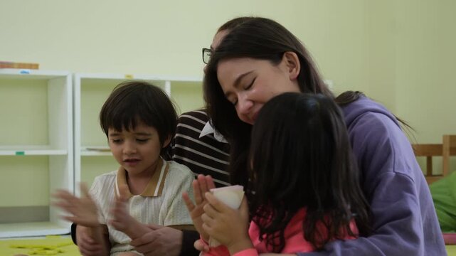 The teacher told a story and invited the children to participate in classroom activities.
