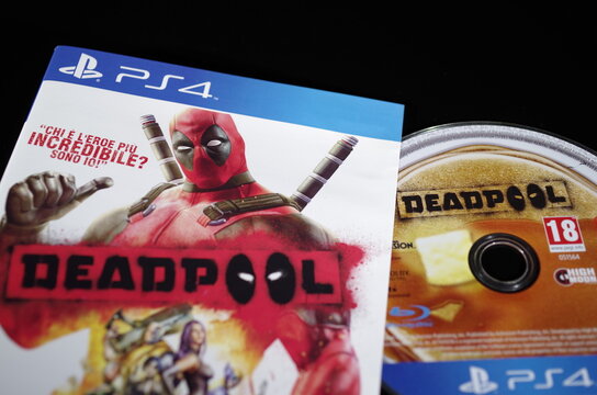 Rome, Italy - June 20, 2026, detail of the cover and Blu-ray Disc of the game Deadpool, the 2013 video game based on the adventures of the Marvel Comics character of the same name, for PlayStation 4.