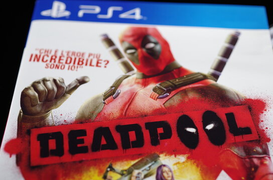 Rome, Italy - June 20, 2026, detail of the cover and Blu-ray Disc of the game Deadpool, the 2013 video game based on the adventures of the Marvel Comics character of the same name, for PlayStation 4.