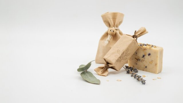 Handmade organic soap bars with eco friendly paper packaging and lavender isolated on white background