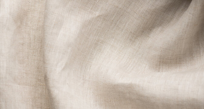Linen texture natural fabric eco linen folded background. Bio textile material backdrop, canvas top view, close-up 