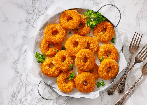 Crisp Gouda Rounds on a marble table