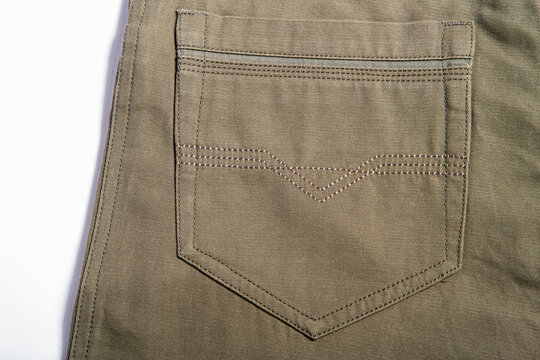 Detailed image of men's casual trousers on a white background