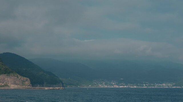 Distant Cityscape Across the Bay Viewed from an Inlet