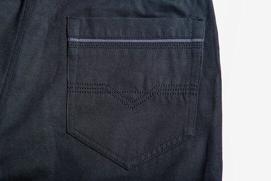 Detailed image of men's casual trousers on a white background